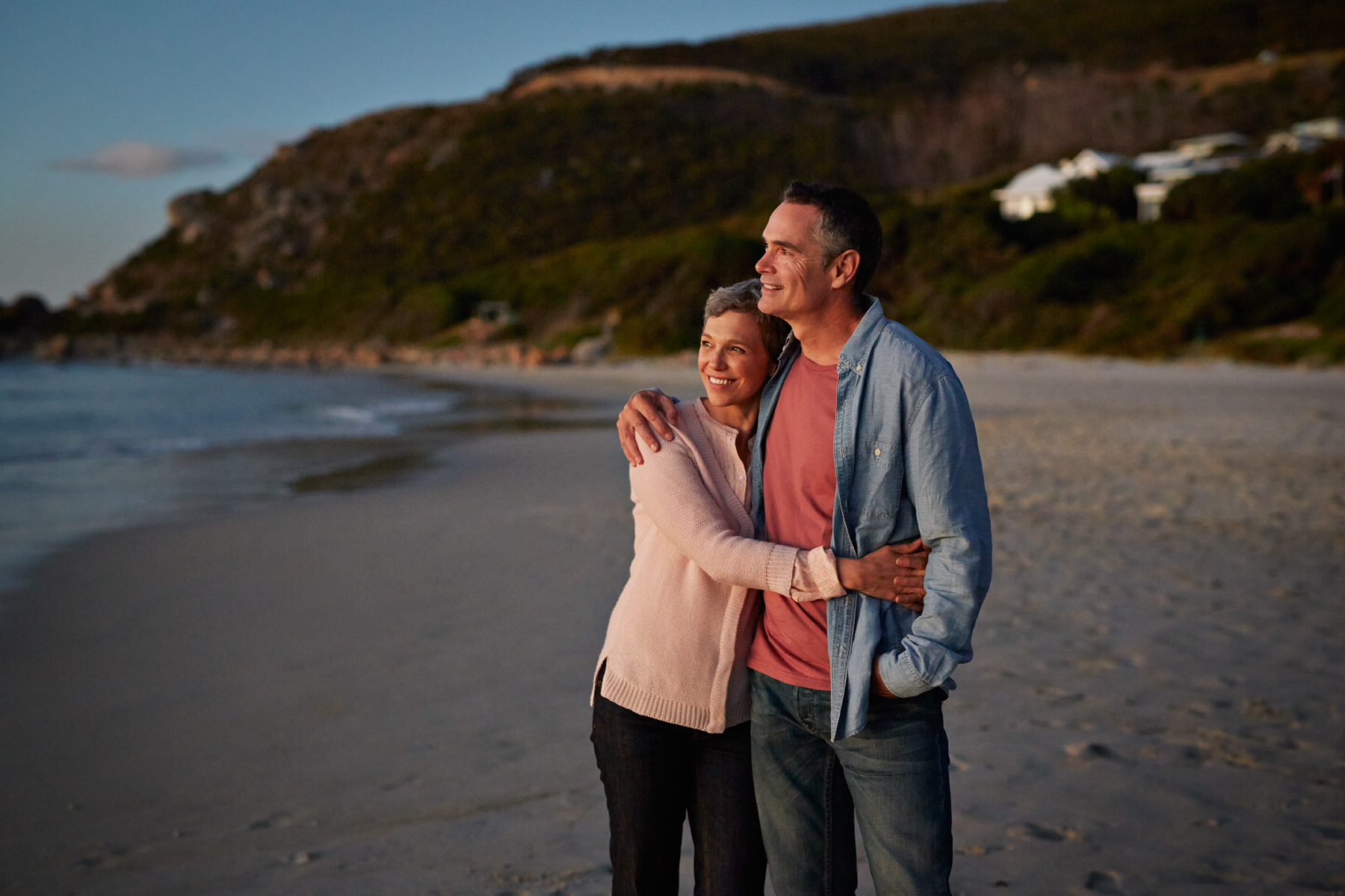 Senior couple enjoying the sunset at beach